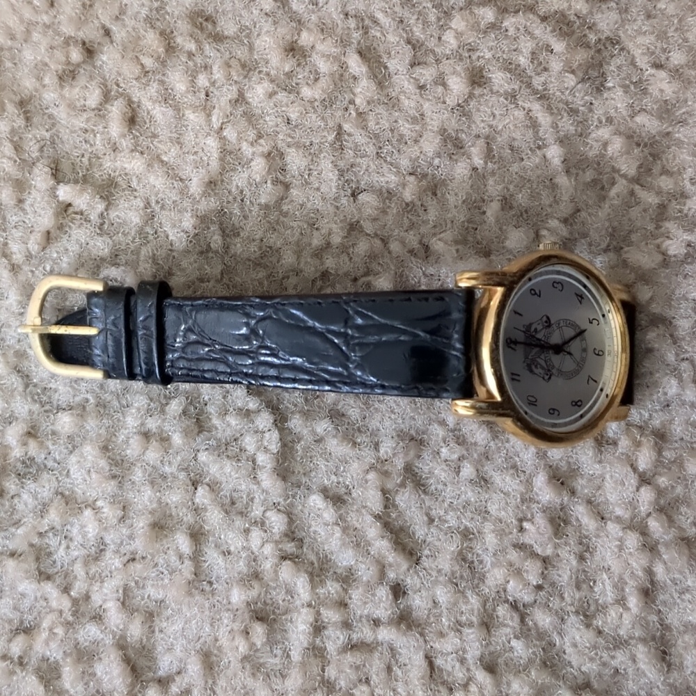Women Black and gold Teamster watch
